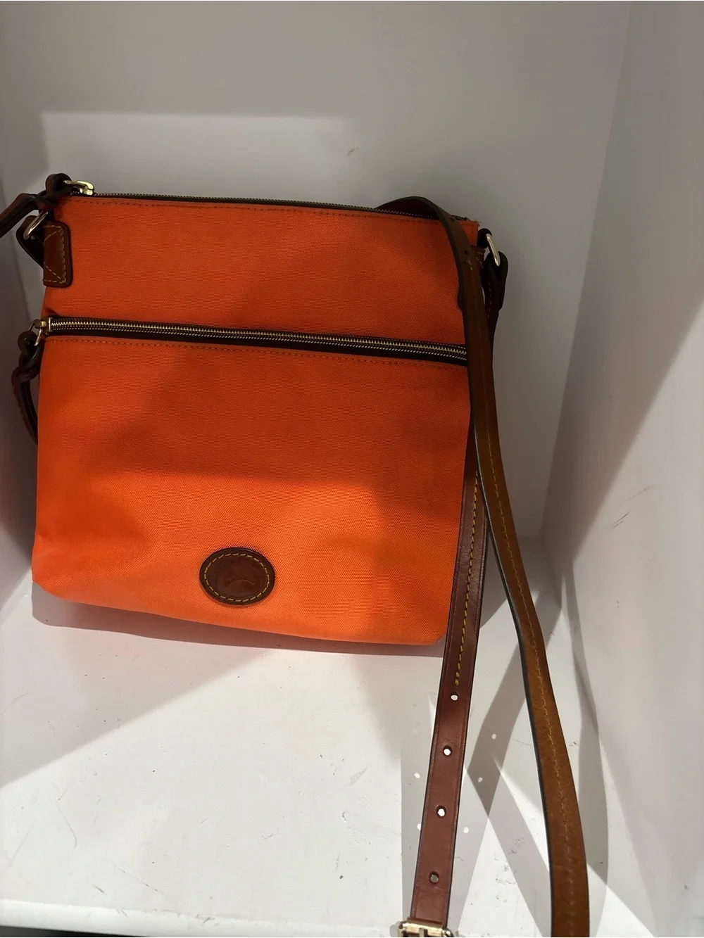 Dooney & Bourke Bright Orange Crossbody with Brown Leather Strap